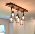 THE STEEL WORKER  industrial pipe fitting  cage pendant barn wood chandelier
