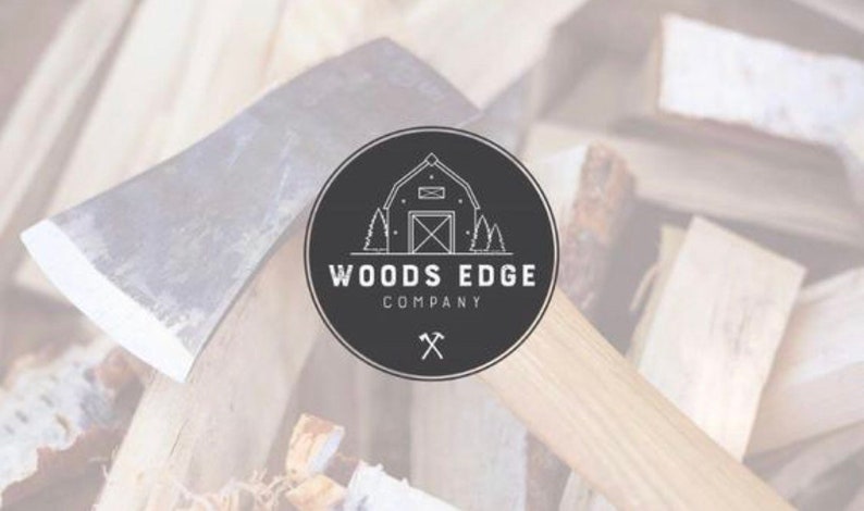 May include: Black and white logo for Woods Edge Company, featuring a stylized image of a cabin with trees and an axe. The logo is on a black circle with a white outline.