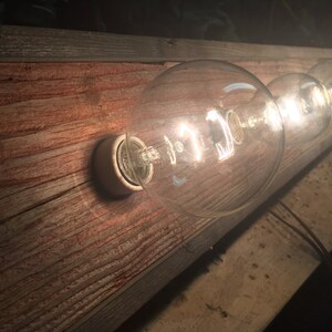 The BUFFALO CREEK 4 bulb barnwood Rustic vanity light image 5