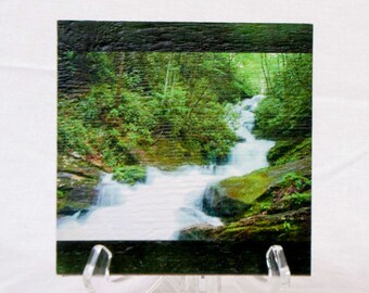 Beautiful secluded waterfall on a wood print. This original photo is given added dimension by the wonderful texture of the milled board.