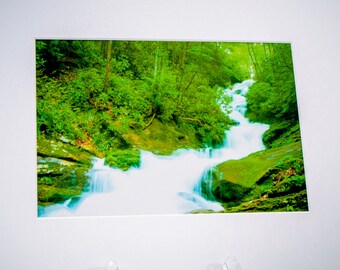 Beautiful, secluded, waterfall photograph. This original photo is lustre coated, matted with an archival mat and mounted on a foam board.