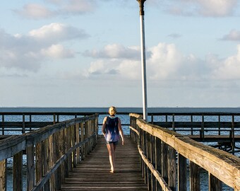 Photograph - "Highlights"  Girl on a dock - Lake Apopka in Oakland, Florida on a beautiful blue sky day - a range of sizes and media