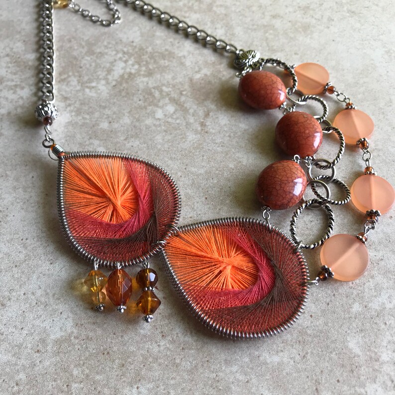 Upcycled orange sorbet statement necklace featuring recycled thread earrings  funky orange necklace