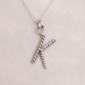 May include: A set of three ceramic mugs with a speckled, matte finish. The mugs are in shades of cream, light gray, and dark gray. Each mug has a simple, minimalist design, perfect for coffee or tea.