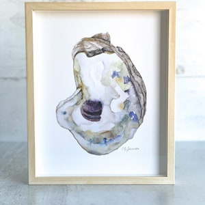 May include: A watercolor painting of an oyster shell with a purple pearl inside. The shell is painted in shades of blue, green, and brown. The artist's signature, "C.G. Sawyers", is in the bottom right corner.
