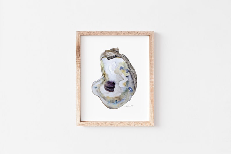 May include: A watercolor painting of an oyster shell with a purple interior. The shell is a light brown color with blue and green accents. The painting is framed in a light wood frame.