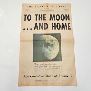 May include: A vintage newspaper front page from The Kansas City Star titled TO THE MOON ... AND HOME. It features a large photograph of the moon, the quote One small step for man; one giant leap for mankind, and The Complete Story of Apollo 11.