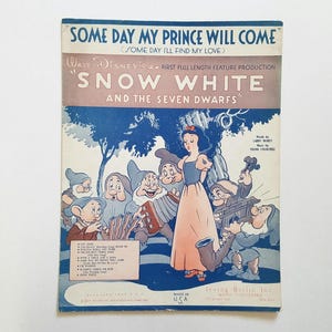 May include: A vintage sheet music cover for the song "Some Day My Prince Will Come" from the Walt Disney movie "Snow White and the Seven Dwarfs". The cover features a colorful illustration of Snow White and the Seven Dwarfs in a forest setting.