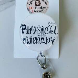 May include: White badge reel with a white button and a white round button with black text that says "Physical Therapy" with black icons of a person exercising, a person walking with a cane, a person doing a physical therapy exercise, and a person in a wheelchair.