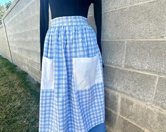 Pioneer, trek, theatre, plays, colonial, prairie, historical events, reenactments. Solid blue skirt with white and blue checked apron set.