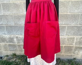 Pioneer, trek, theatre, plays, colonial, prairie, historical events, reenactments. Cream and red print skirt with dark red apron set.