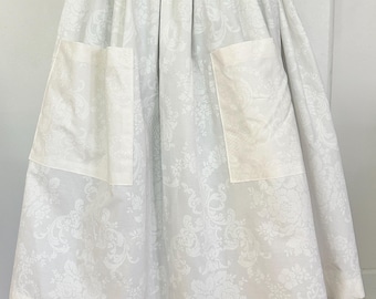 Pioneer, trek, theatre, plays, colonial, prairie, historical events, reenactments. Blue print skirt with white on white apron set.