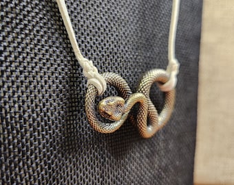 Brass Serpent Necklace: Detailed Snake Pendant on Suede Cord