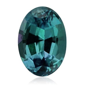 Puede incluir: Una piedra preciosa ovalada de color turquesa con un corte facetado.