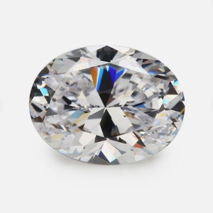 May include: A clear oval-shaped diamond gemstone with many facets.