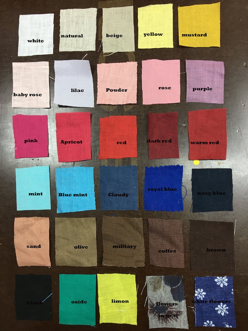 May include: A collection of fabric swatches in various colors, including white, pink, red, blue, and green. Each swatch is labeled with its color name, such as "white," "red," and "navy blue." The swatches are arranged in rows and columns.
