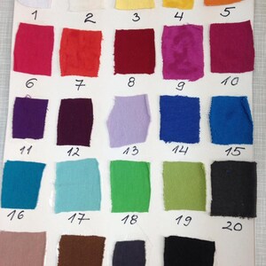 May include: A color swatch chart featuring 24 fabric samples in various colors, including white, yellow, orange, red, purple, blue, green, and black. Each swatch is numbered from 1 to 24.