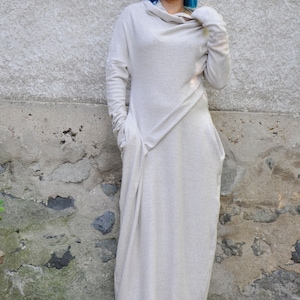 Long white dress with long sleeves made from cashmere. Kaftan style with cowl neck, perfect for winter.