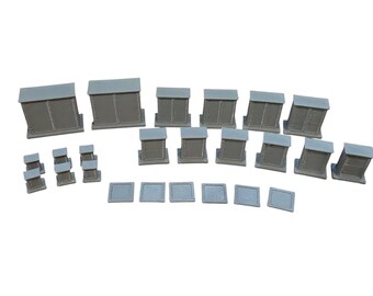 May include: A collection of gray miniature furniture pieces including two large rectangular cabinets, seven medium-sized rectangular cabinets, three small square pedestals, and six flat square tiles, all featuring a smooth, matte finish.