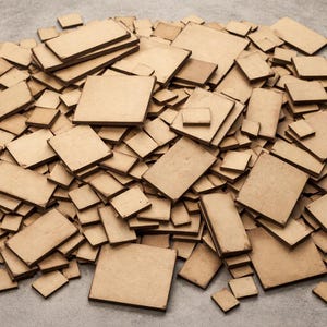 May include: A pile of various sized, unfinished, light brown wooden squares and rectangles. The shapes are scattered across a neutral surface, with some stacked on top of each other. The wood has a natural grain.