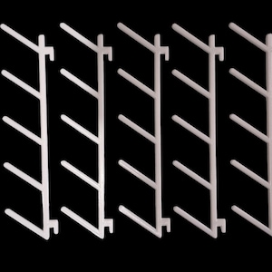May include: Five white plastic display racks, each with a series of angled arms. The racks are arranged vertically against a black background. The arms are evenly spaced and designed to hold items.