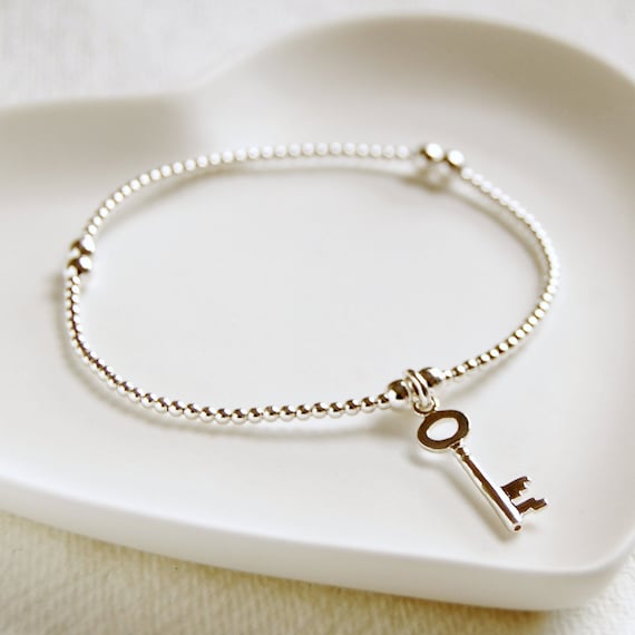Key charm bracelet best sale