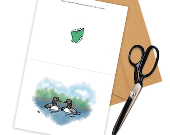 May include: A greeting card with a green outline of the state of Ohio with the text "From Me With Love" and a drawing of two loons swimming in a lake.