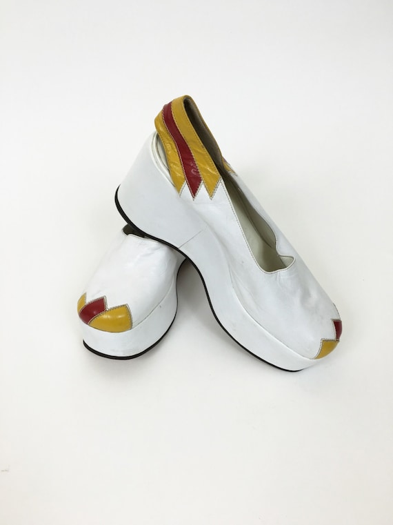 Vintage 1970s white and yellow leather platform we