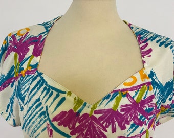 Vintage 1970s 1980s jersey tropical colorful print and triangular open back neckline dress size M