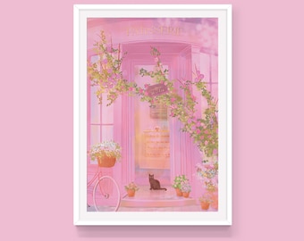 May include: A framed illustration of a pink patisserie with the word "PATISSERIE" above the door. A black cat sits on the steps. A pink bicycle with a basket of flowers is on the left. The shop is decorated with flowers and greenery.