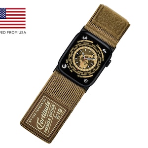 May include: A black Apple Watch with a brown nylon strap. The watch face displays a world map with time zones and the text "Fortitude Premier Edition 2018".