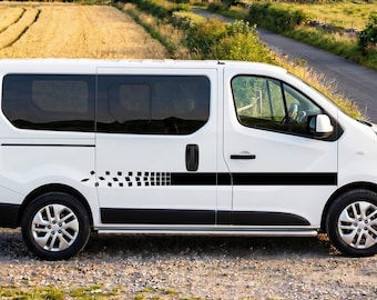 May include: A white van featuring a black horizontal stripe graphic along the side, which transitions into a series of small black squares toward the rear. The vehicle has tinted windows, black door handles, and silver multi-spoke wheels.