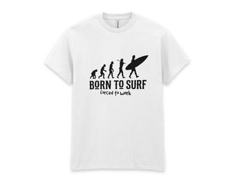 May include: A white short-sleeved t-shirt featuring a black graphic of human evolution progressing from an ape to a surfer carrying a surfboard. Below the graphic, the text reads BORN TO SURF in bold letters and forced to work in smaller font.