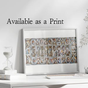 May include: A framed print of Michelangelo's The Last Judgement fresco on the ceiling of the Sistine Chapel. The print is in a white frame and is available as a print.