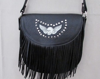 Black leather cross body bag .