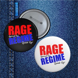 May include: Two round buttons with the text "RAGE Against the REGIME Speak Up!" in red and blue. One button is black, the other is white. The buttons are on a denim background.