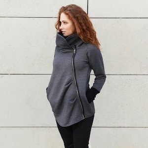 Ameri UND ASYMMETRY COLLAR JACKET¥21,450 Ceil Blue Scrub Warmup Jacket by American Dawn