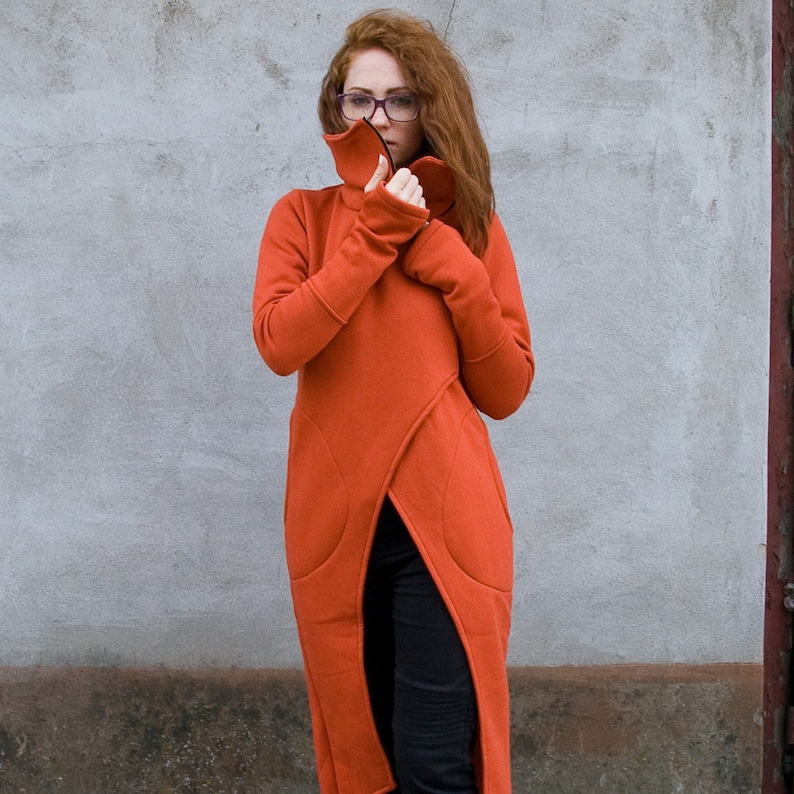 Burnt orange long asymmetrical coat with turtleneck in plus size.