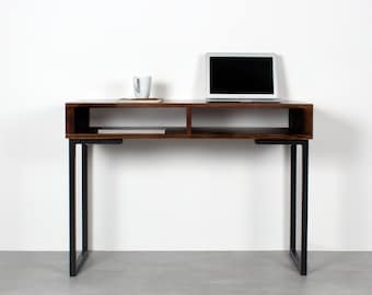 May include: A dark brown wooden desk with black metal legs. The desk has two shelves and a laptop computer on the top shelf.