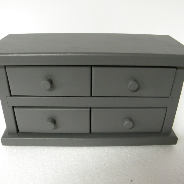 Four drawer apothecary table or counter cabinet. A custom Dark grey in color from  Old Century paints. 5"deep, 13" wide and 7.5 high.