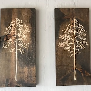 Pair of aspen trees hand carved on stained pine boards