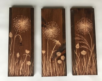 Three hanging wild flower carved wood and stained wood wall art  20" X 7.25wide