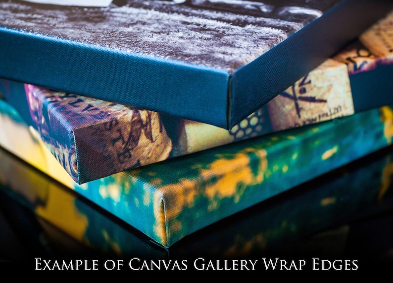 May include: Close-up of the edges of three canvas prints, showing how the image wraps around the sides. The top print has a blue border, the middle print has a cork and floral design, and the bottom print has a green and yellow design.