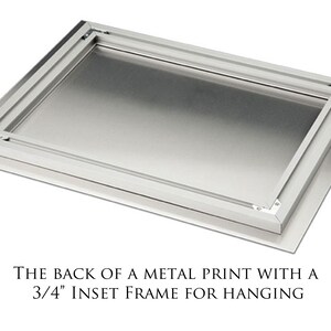May include: The back of a metal print with a 3/4 inch inset frame for hanging.