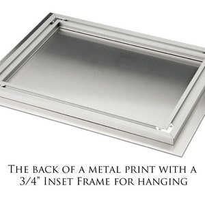 May include: The back of a metal print with a 3/4 inch inset frame for hanging.