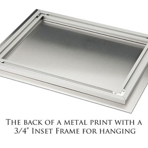 May include: The back of a metal print with a 3/4 inch inset frame for hanging.