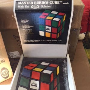 1981 Ideal The Ideal Solution Guide to the Rubiks Cube store display with 12 mint books rare