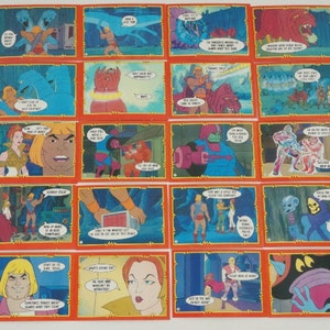 May include: A set of 20 trading cards featuring characters from the He-Man and the Masters of the Universe cartoon series. The cards are red and blue with a gold border. Each card features a different character or scene from the show. The cards are in good condition and have no visible damage.