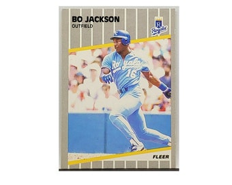 May include: A baseball card featuring Bo Jackson, an outfielder for the Kansas City Royals. The card is from the 1989 Fleer set and features a photo of Jackson in his Royals uniform, running the bases.