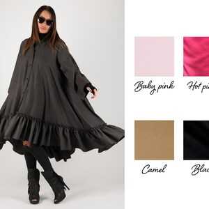 May include: A dark gray, button-down dress with a ruffled hem. The dress has long sleeves and a high-low design. The image also shows color swatches labeled "Baby pink", "Hot pink", "Camel", and "Black".